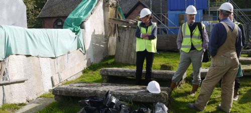 Sam Russell (centre) joins in the debate on limewash colours for the church exterior